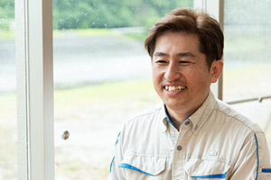Toshimune Miyachi speaking against the backdrop of Kuma River