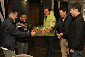 Taking a break at a barbecue with fellow Japanese expatriates