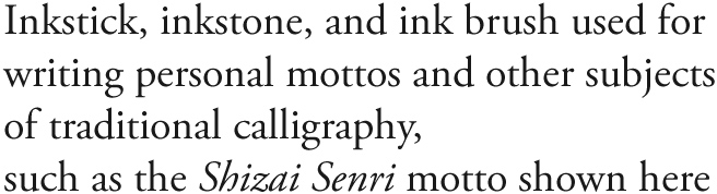 Inkstick, inkstone, and ink brush used for writing personal mottos and other subjects of traditional calligraphy, such as the Shizai Senri motto shown here