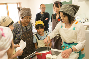 A cookery class at the housing development's meeting-place